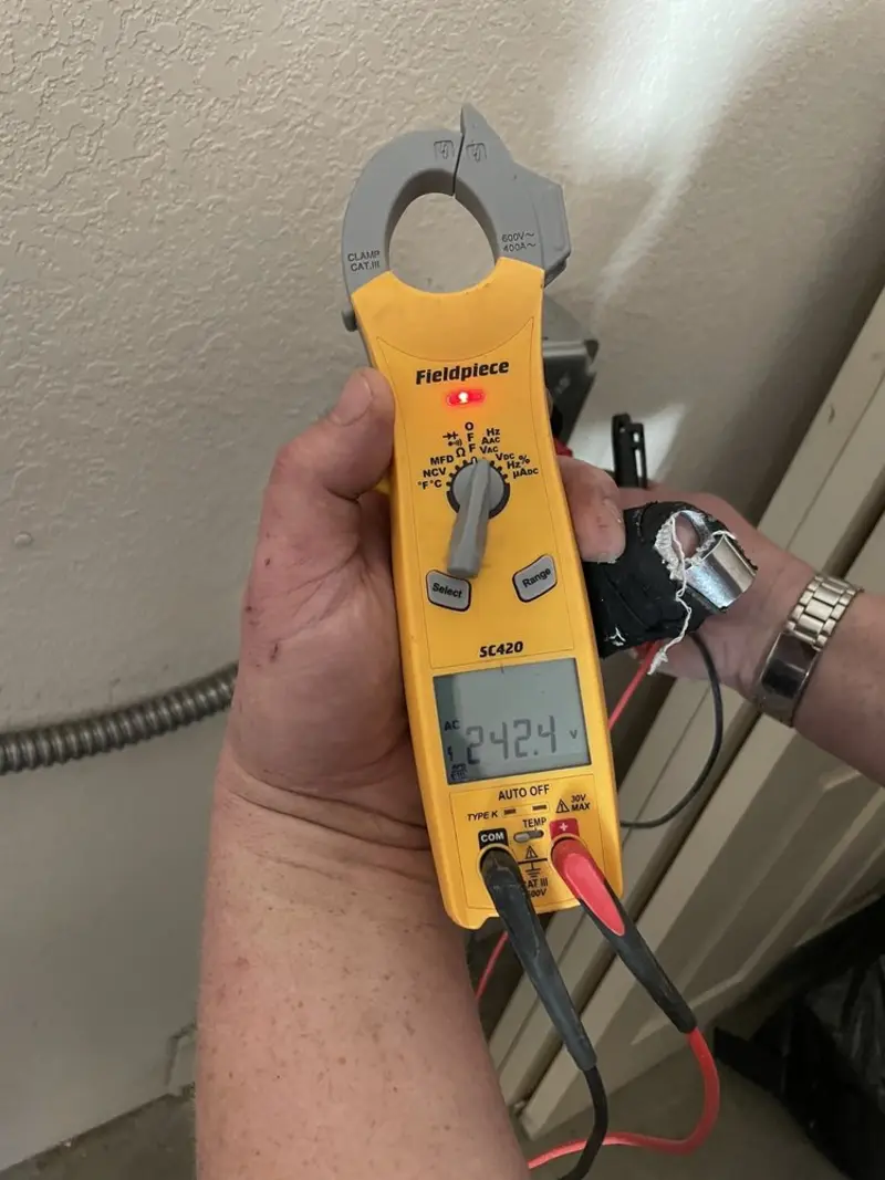 Voltage testing with clamp meter during Outlet Installation in Lonsdale